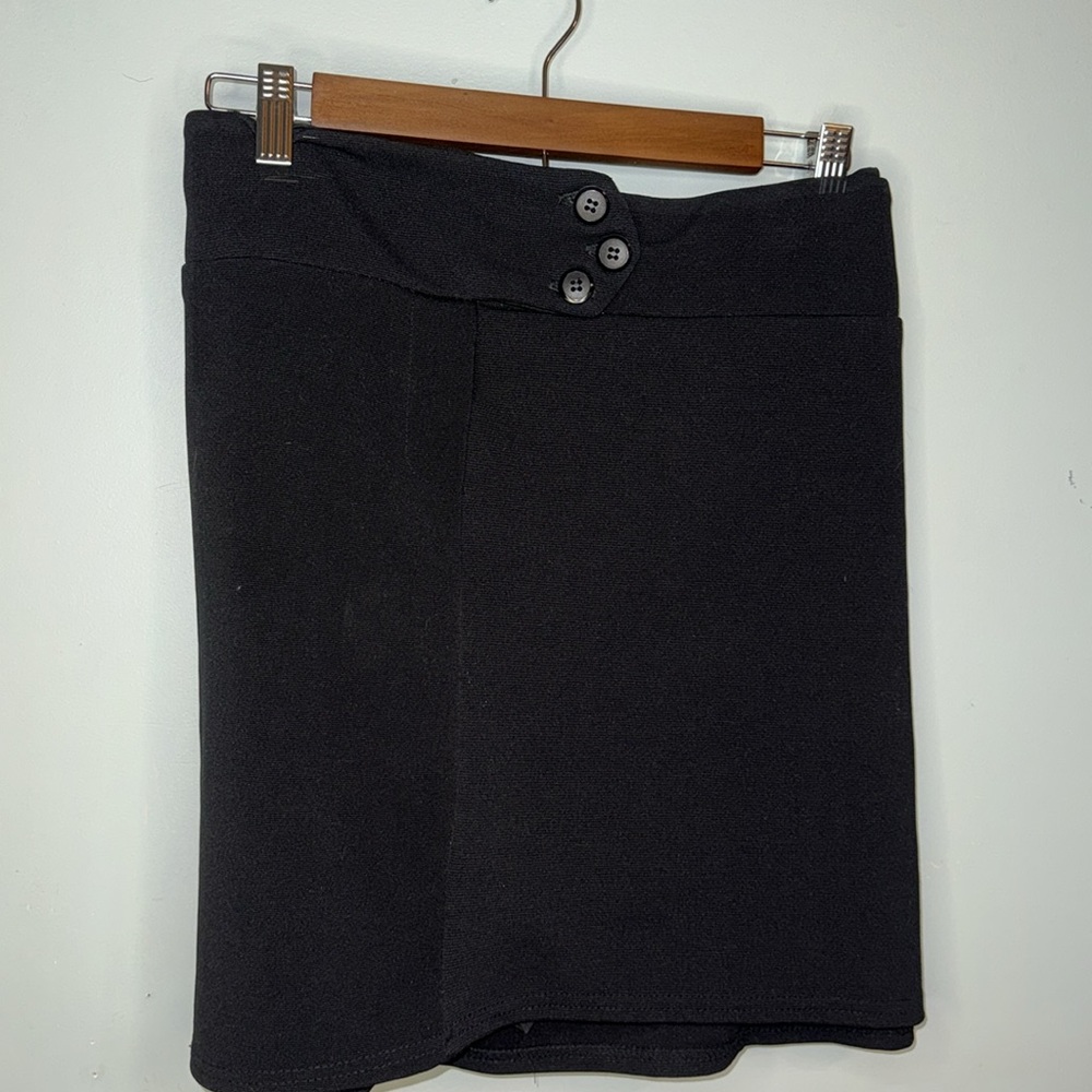 Black skort. Button details in front on middle top. Stretchy comfortable. A